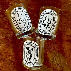 Three empty diptyque jars.  Figure, menthe vert and Chene (fig, mint, oak)